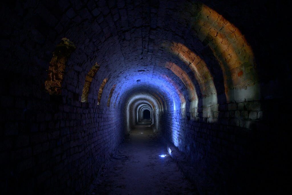 underground tunnel lighted up with blue light